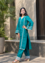 eal green kurta set for women with white lace detailing and flared sleeves